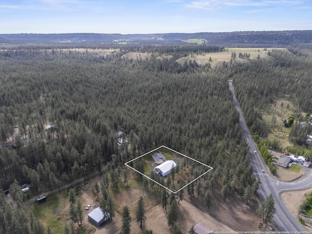 7905 W Seven Mile Rd, Nine Mile Falls, WA 99026 - aerial overview of property's location with a forest and property boundaries highlighted