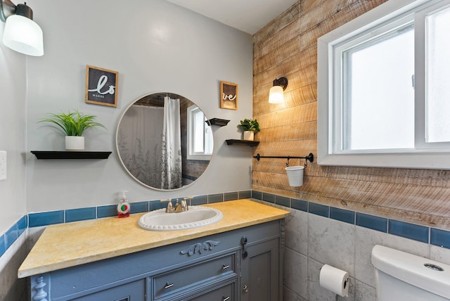561 E Forest Ave, Colville, WA 99114 - bathroom featuring tile walls and vanity