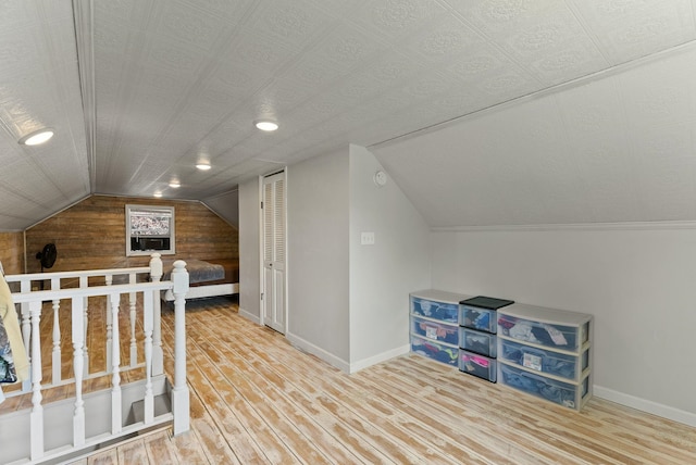 561 E Forest Ave, Colville, WA 99114 - additional living space featuring wood finished floors, vaulted ceiling, and wooden walls