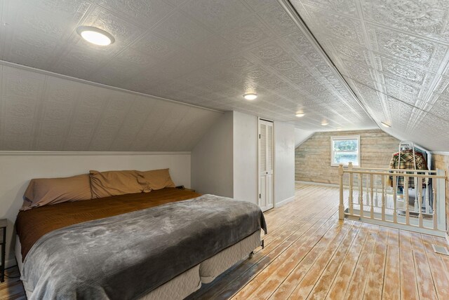 561 E Forest Ave, Colville, WA 99114 - bedroom featuring hardwood / wood-style flooring, a closet, and vaulted ceiling