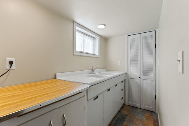 561 E Forest Ave, Colville, WA 99114 - kitchen with a sink and dark stone finish flooring