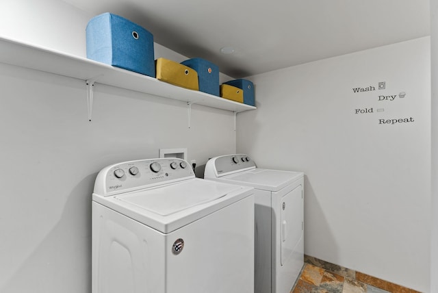 561 E Forest Ave, Colville, WA 99114 - laundry room with washer and clothes dryer and light stone finish flooring