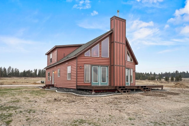 5011B Mason Rd, Clayton, WA 99110 - view of property exterior with log veneer siding and a chimney