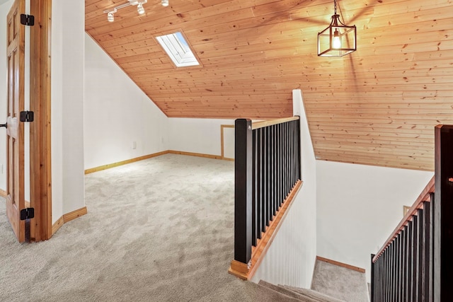 5011B Mason Rd, Clayton, WA 99110 - stairway featuring carpet flooring, a skylight, wooden ceiling, and vaulted ceiling