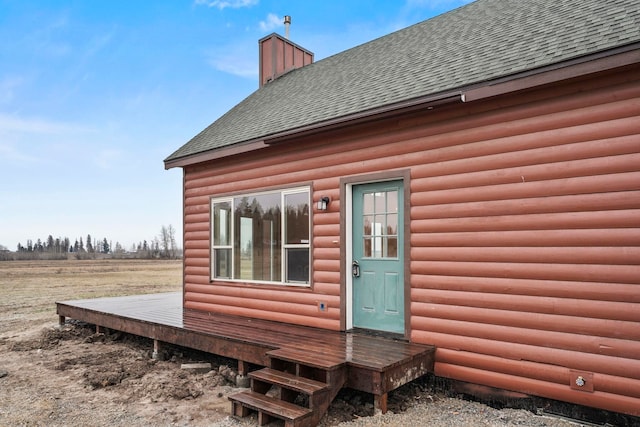 5011B Mason Rd, Clayton, WA 99110 - view of side of home featuring a shingled roof, a wooden deck, a chimney, and faux log siding