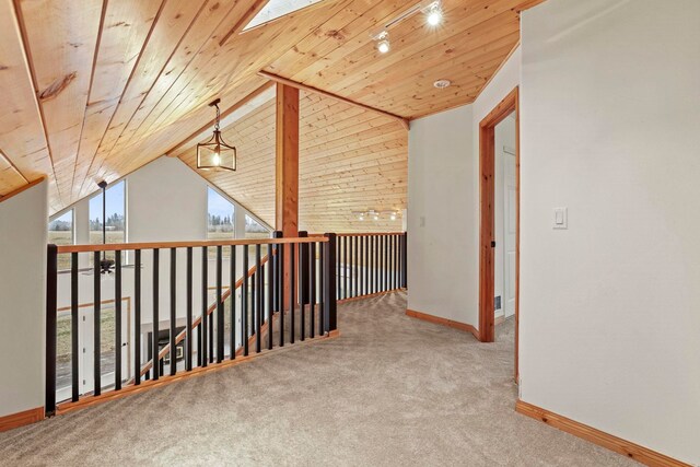 5011B Mason Rd, Clayton, WA 99110 - corridor featuring wood ceiling, carpet floors, vaulted ceiling, an upstairs landing, and a skylight