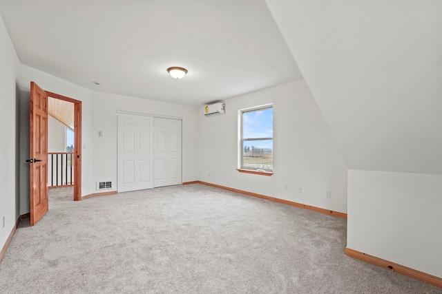 5011B Mason Rd, Clayton, WA 99110 - unfurnished bedroom featuring a wall mounted air conditioner, carpet floors, and a closet