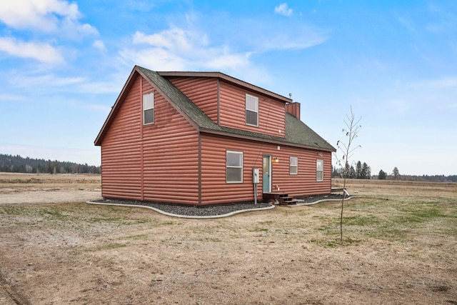 5011B Mason Rd, Clayton, WA 99110 - view of property exterior featuring log veneer siding, roof with shingles, and entry steps