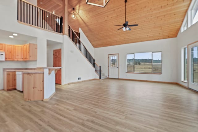 5011B Mason Rd, Clayton, WA 99110 - unfurnished living room with high vaulted ceiling, stairs, wooden ceiling, a ceiling fan, and light wood finished floors
