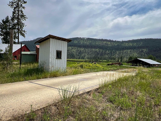 820 Echo Stub Rd, Colville, WA 99114 - view of shed with a wooded view and a mountain view