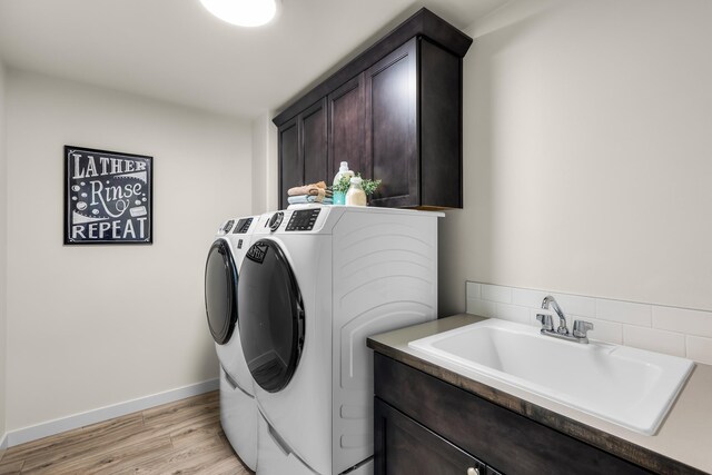 1415 W 67th Avenue Lot 1Block 4 - Talent, Spokane, WA 99224 - washroom featuring washing machine and clothes dryer, cabinet space, and light wood-style flooring