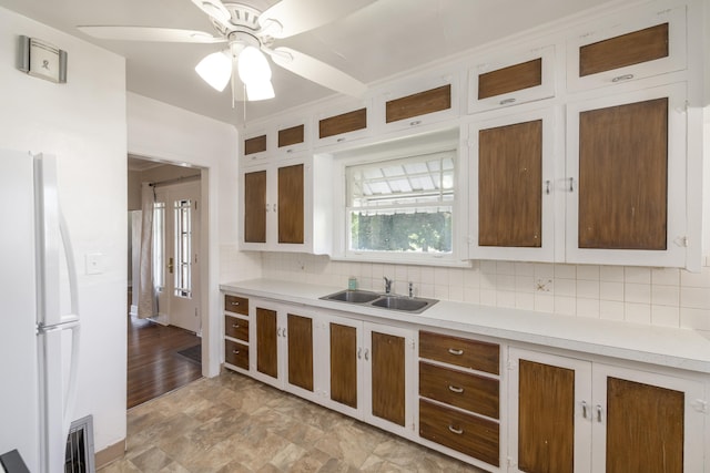 530 W Gordon Ave Unit 013, Spokane, WA 99205 - kitchen featuring freestanding refrigerator, a ceiling fan, tasteful backsplash, light countertops, and glass insert cabinets