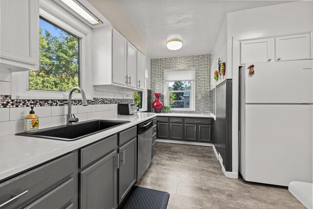 824 E E 38th Ave, Spokane, WA 99203 - kitchen with freestanding refrigerator, gray cabinets, dishwasher, light countertops, and tasteful backsplash