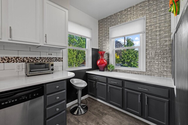 824 E E 38th Ave, Spokane, WA 99203 - kitchen featuring dishwasher, plenty of natural light, light countertops, tasteful backsplash, and wallpapered walls