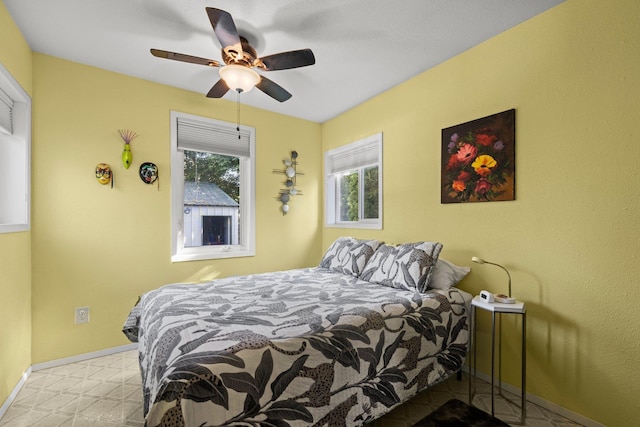 824 E E 38th Ave, Spokane, WA 99203 - bedroom featuring baseboards and ceiling fan