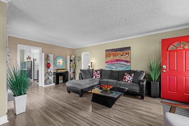 824 E E 38th Ave, Spokane, WA 99203 - living area featuring wood finished floors, ornamental molding, a textured ceiling, and arched walkways
