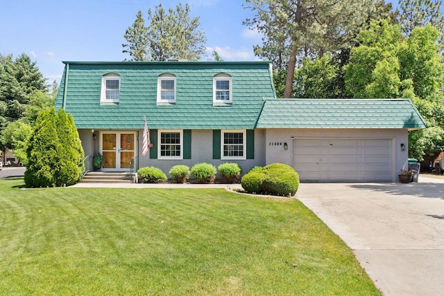 11628 N Galahad Dr, Spokane, WA 99218 - view of front facade with stucco siding, a garage, a front yard, driveway, and french doors