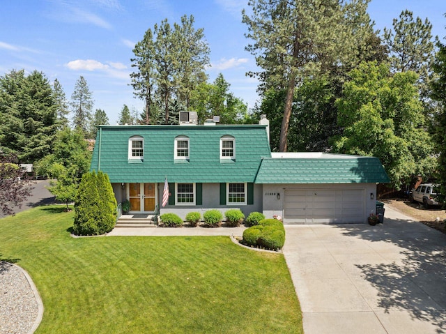 11628 N Galahad Dr, Spokane, WA 99218 - view of front of home with an attached garage, concrete driveway, a front lawn, stucco siding, and a chimney