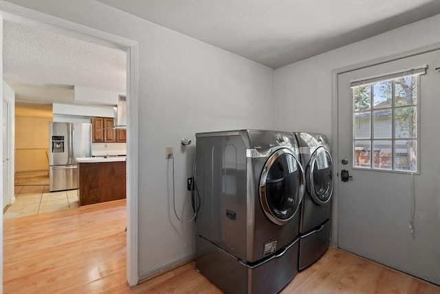 11628 N Galahad Dr, Spokane, WA 99218 - laundry room featuring independent washer and dryer and light wood-style floors