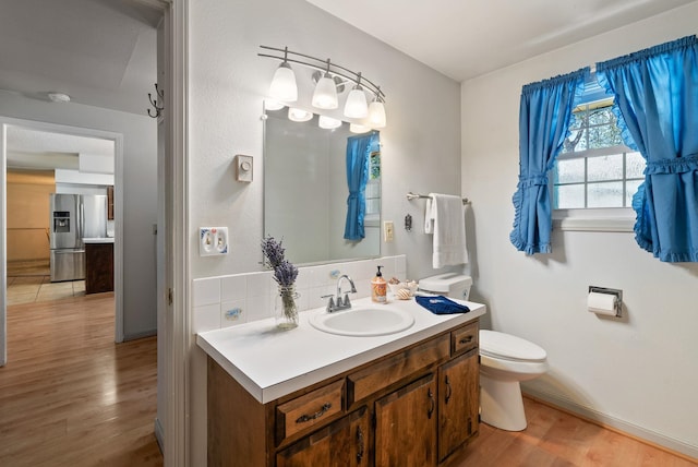 11628 N Galahad Dr, Spokane, WA 99218 - bathroom with wood finished floors and vanity