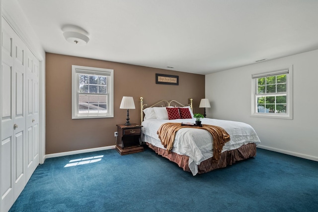 11628 N Galahad Dr, Spokane, WA 99218 - bedroom with dark carpet and a closet