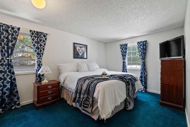 11628 N Galahad Dr, Spokane, WA 99218 - bedroom featuring dark carpet and a textured ceiling