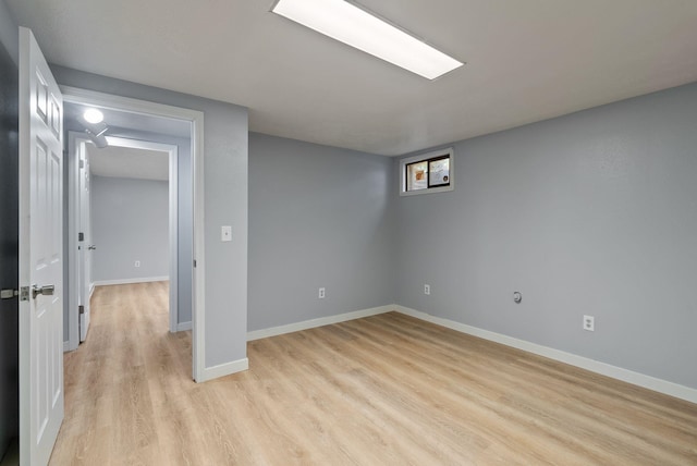 11628 N Galahad Dr, Spokane, WA 99218 - finished below grade area with light wood-type flooring and baseboards