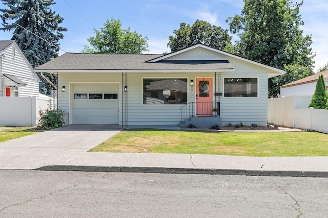 2917 W Dalton Ave, Spokane, WA 99205 - view of front of property with a garage, concrete driveway, and roof with shingles