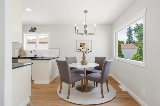 2917 W Dalton Ave, Spokane, WA 99205 - dining area with a chandelier, healthy amount of natural light, light wood-style flooring, and recessed lighting