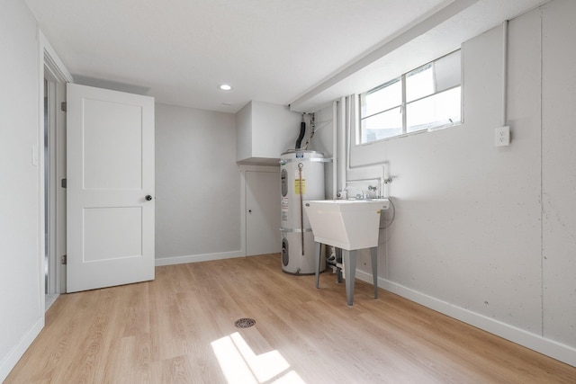 2917 W Dalton Ave, Spokane, WA 99205 - below grade area featuring water heater, light wood-style floors, and recessed lighting