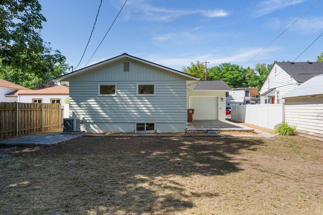 2917 W Dalton Ave, Spokane, WA 99205 - back of property with a fenced backyard and a garage