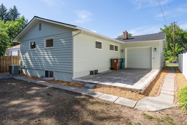 2917 W Dalton Ave, Spokane, WA 99205 - view of side of property featuring a chimney and an attached garage