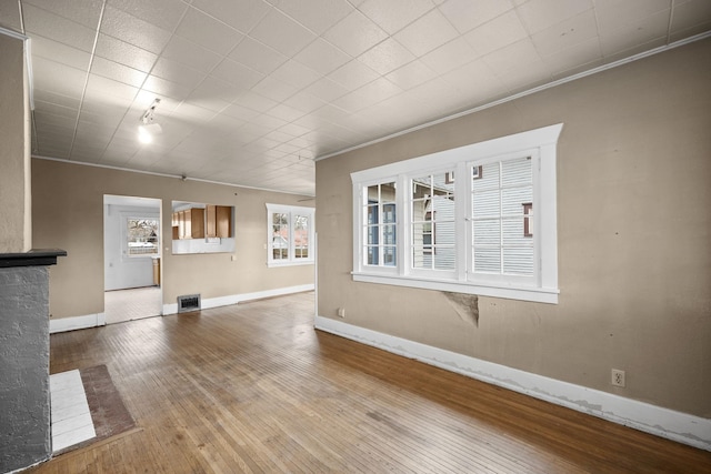 3814 N Calispel St, Spokane, WA 99205 - unfurnished living room with crown molding and hardwood / wood-style flooring