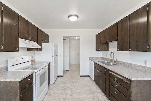 107 E Hattie Ave, Coeur D Alene, ID 83814 - kitchen featuring white appliances, under cabinet range hood, dark brown cabinetry, and light countertops