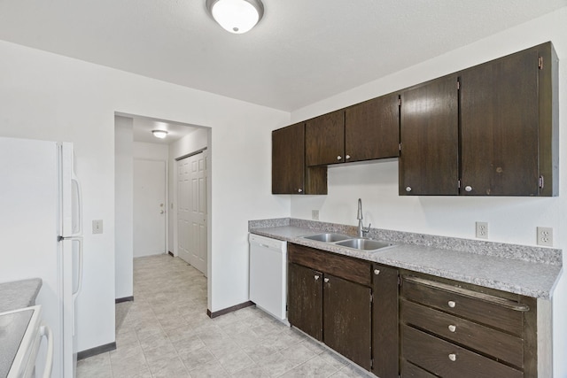 107 E Hattie Ave, Coeur D Alene, ID 83814 - kitchen with white appliances, dark brown cabinets, and light countertops