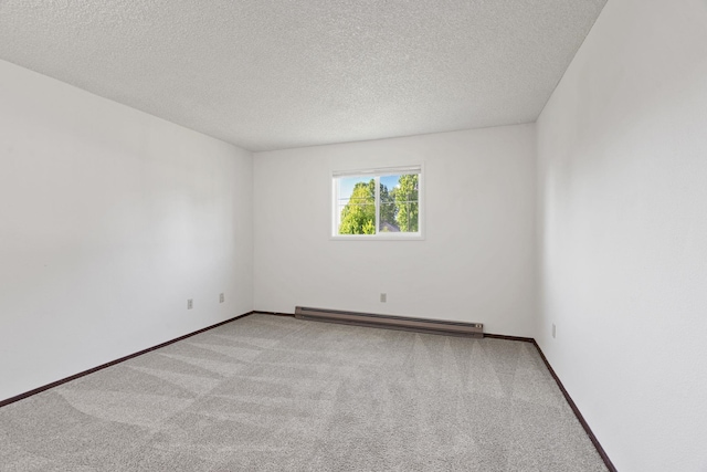 107 E Hattie Ave, Coeur D Alene, ID 83814 - carpeted spare room with a baseboard heating unit and a textured ceiling
