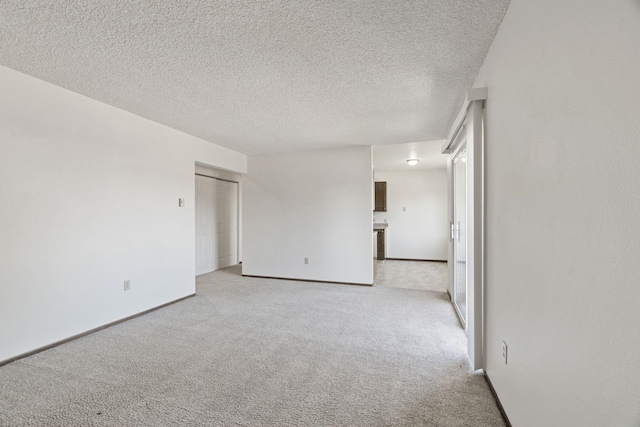 107 E Hattie Ave, Coeur D Alene, ID 83814 - spare room featuring light colored carpet and a textured ceiling