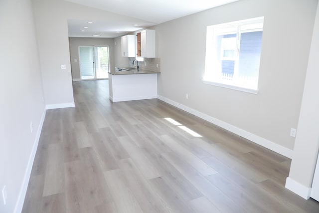 315 E I St, Deer Park, WA 99006 - unfurnished living room with light wood-style flooring and recessed lighting