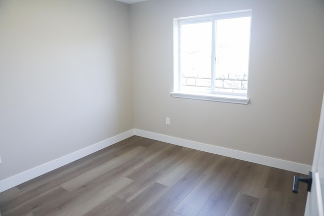 315 E I St, Deer Park, WA 99006 - unfurnished room with baseboards and dark wood-style flooring