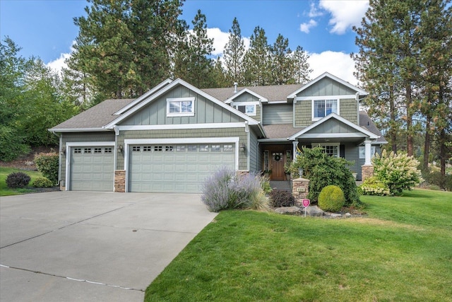 404 W Trail Ridge Ct, Spokane, WA 99224 - craftsman-style house with an attached garage, driveway, a front yard, board and batten siding, and stone siding
