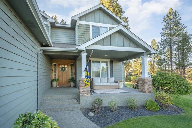 404 W Trail Ridge Ct, Spokane, WA 99224 - view of exterior entry with a porch and board and batten siding