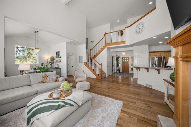 404 W Trail Ridge Ct, Spokane, WA 99224 - living room featuring stairway, high vaulted ceiling, wood finished floors, and recessed lighting