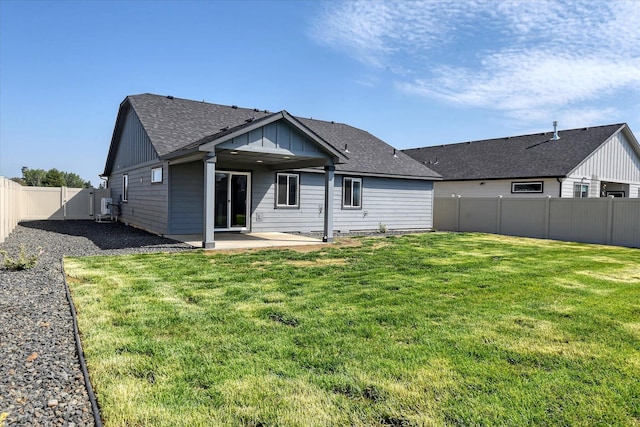 8115 W 57th Ave, Spokane, WA 99224 - rear view of property with a patio area, roof with shingles, and a fenced backyard