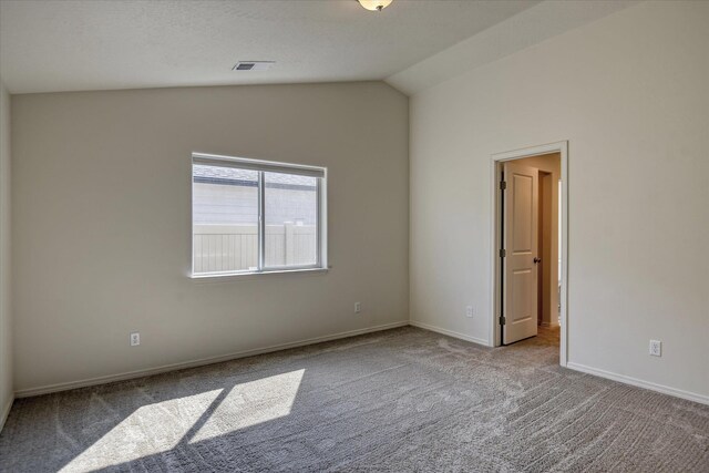 8115 W 57th Ave, Spokane, WA 99224 - carpeted empty room featuring lofted ceiling and baseboards