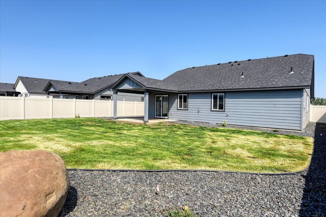 8115 W 57th Ave, Spokane, WA 99224 - back of property featuring a patio and roof with shingles