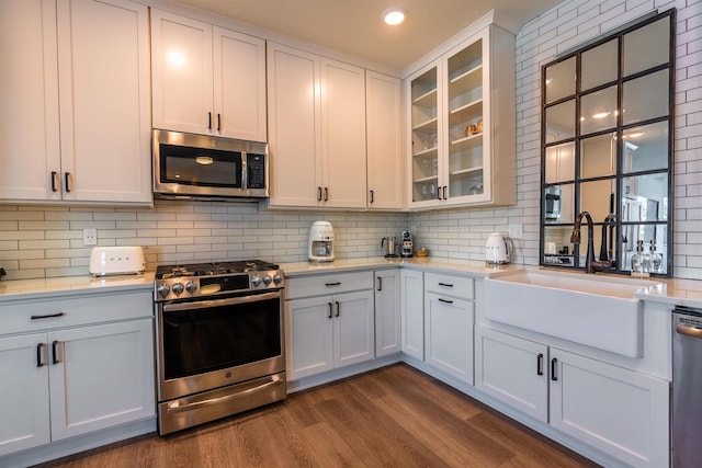 115 E Lake St Unit 203, Sandpoint, ID 83864 - kitchen with appliances with stainless steel finishes, light countertops, backsplash, and recessed lighting