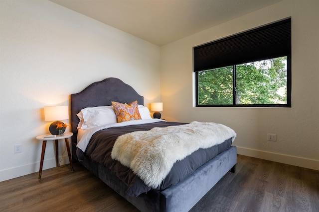 115 E Lake St Unit 203, Sandpoint, ID 83864 - bedroom with wood finished floors and baseboards