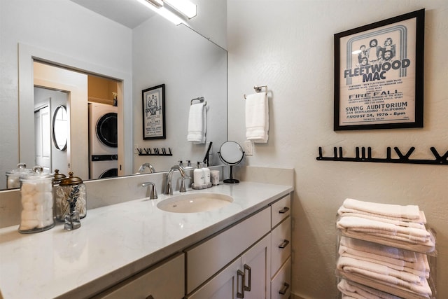 115 E Lake St Unit 203, Sandpoint, ID 83864 - bathroom featuring stacked washer and clothes dryer and vanity