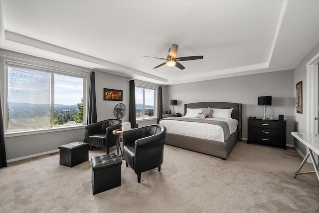 7620 E Ruby Ln, Spokane, WA 99212 - carpeted bedroom featuring a raised ceiling and a ceiling fan