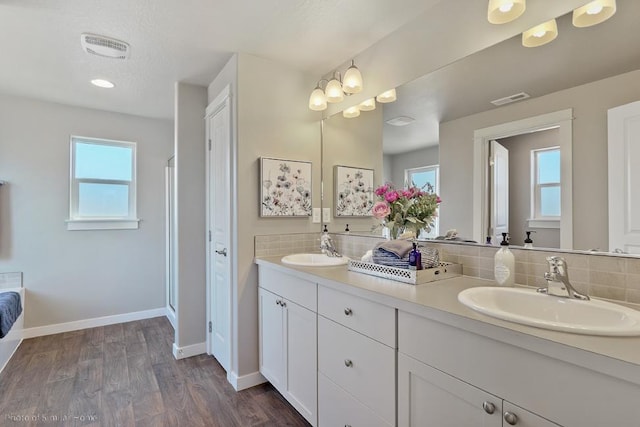 18115 E Barclay Ct Unit 2/3Stoneridge, Encore, Spokane Valley, WA 99016 - full bath with double vanity, tasteful backsplash, wood finished floors, an enclosed shower, and recessed lighting